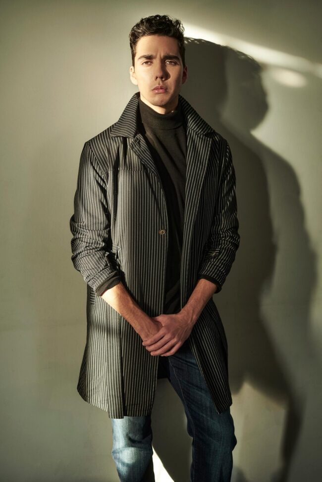 Aspiring model reading a guide on 'how to become a model', Photo session for a modeling portfolio, a step in learning how to become a model, New face at a modeling agency, following tips on how to become a model, Fashion shoot, part of the process in how to become a model, Model in training practicing runway walk, essential for how to become a model, Behind-the-scenes look at a model's preparation, key to becoming a model, Aspiring model attending a casting call, a step towards becoming a model, Fitness regime for models, an aspect of how to become a model, Portfolio review, a crucial phase in how to become a model, Model receiving coaching on posing techniques, important for aspiring models