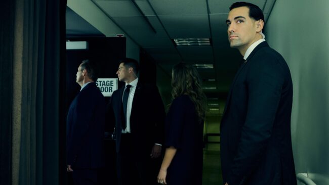 Security team in action captured in a lifestyle photography session, Professional security guard on duty in a lifestyle photo shoot, Lifestyle photography depicting a security briefing for an event, Security personnel patrolling a shopping center in a lifestyle image, Close-up lifestyle shot of security communication equipment in use, Security guards ensuring safety at a private event, captured in lifestyle photos, Lifestyle image of a security professional escorting a client, Security team coordination captured in a dynamic lifestyle photograph, Vigilant security presence at a public gathering, Lifestyle photography showcasing a security company's commitment to safety